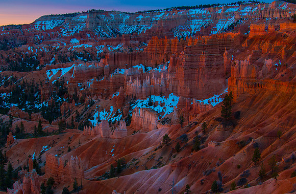 The Rising Sun Lights the Hoodoos Below Sunset Point